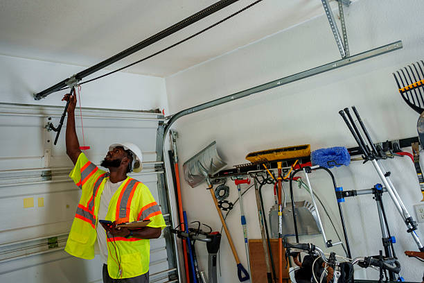 Professional Garage Door Panel Replacement technician working in Herington, KS